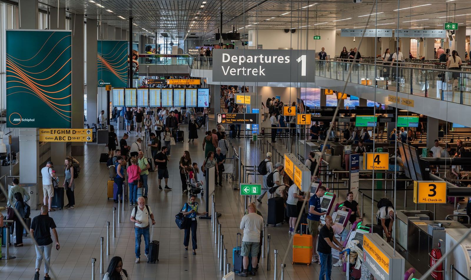 Passengers in an airport departures hall
