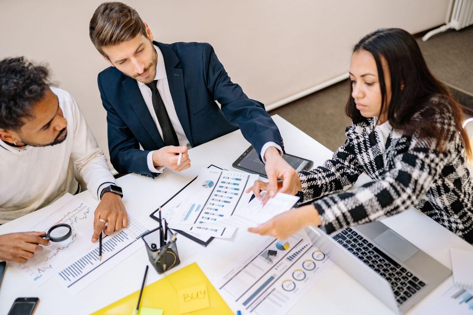A business team working together around a table
